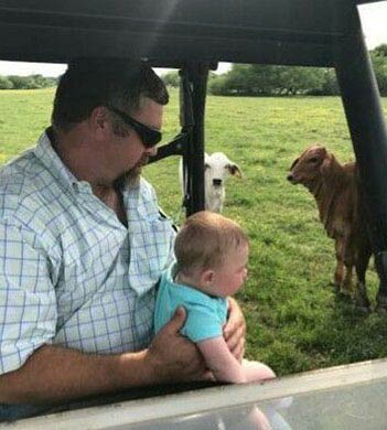 JW-Gallery-baby-on-car-with-calves